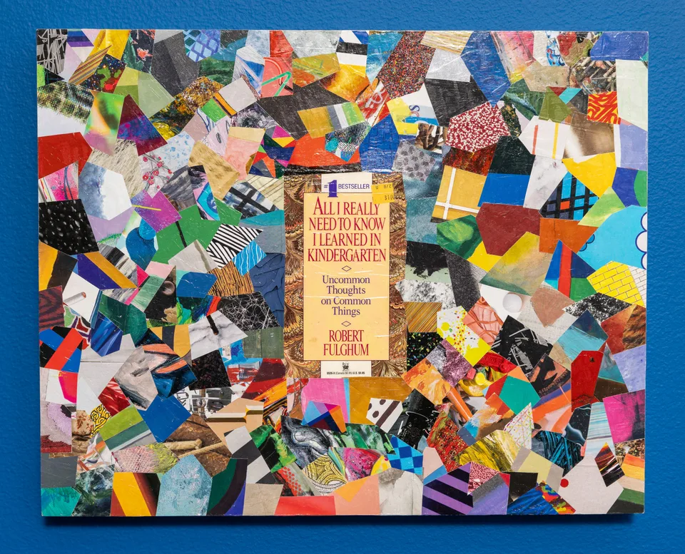 A collage of brightly colored paper fragments surrounds a paperback book cover.