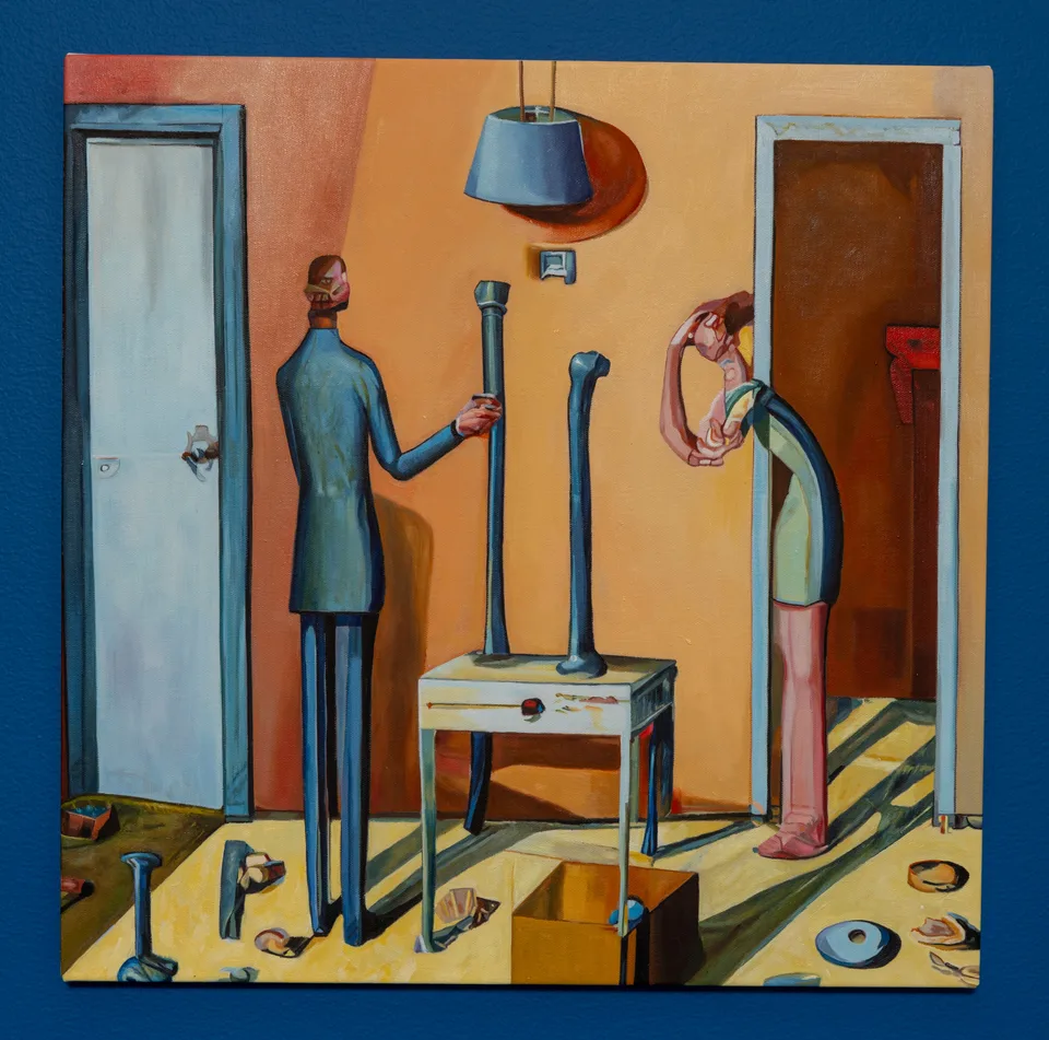 A square painting depicts two elongated figures standing by a small table and scattered parts in a yellow room.