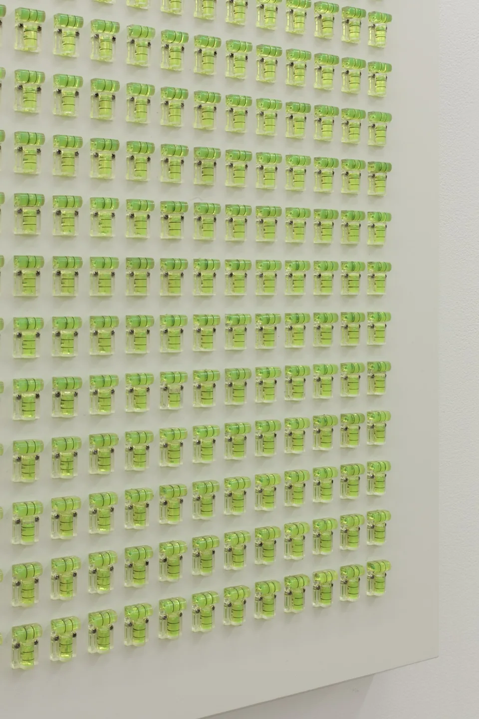 Angled detail of rows of lime-green fittings