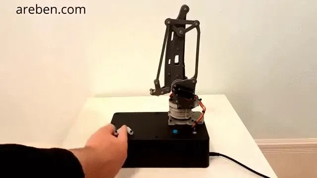 The First Law robotic arm beside a participant's hand