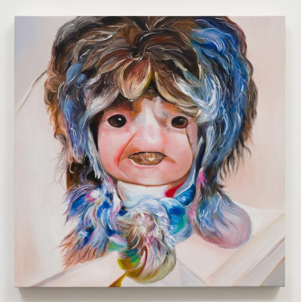 An oil painting of a doll-like face framed by blue and brown hair with a multicolored collar.