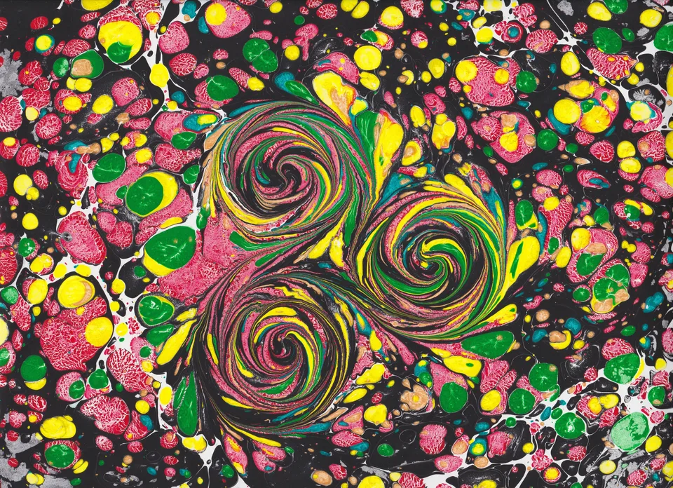 Two swirling centers surrounded by vivid pink, green, and yellow marbled patterns