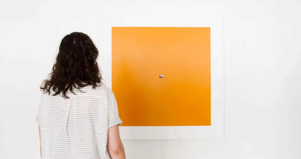 A gallery visitor stands in front of Presence #2