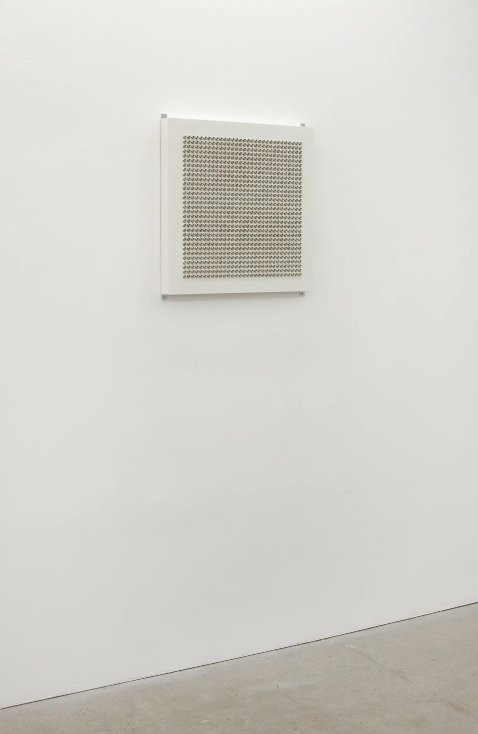 A square panel filled with a dense grid of small metallic domes