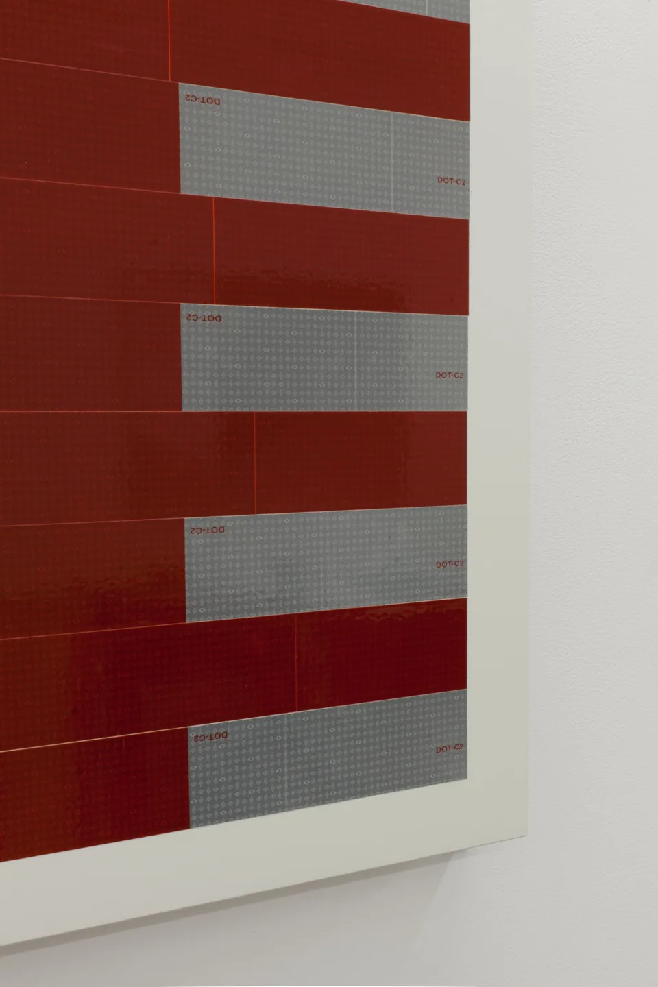 Oblique detail of red and silver rectangular strips